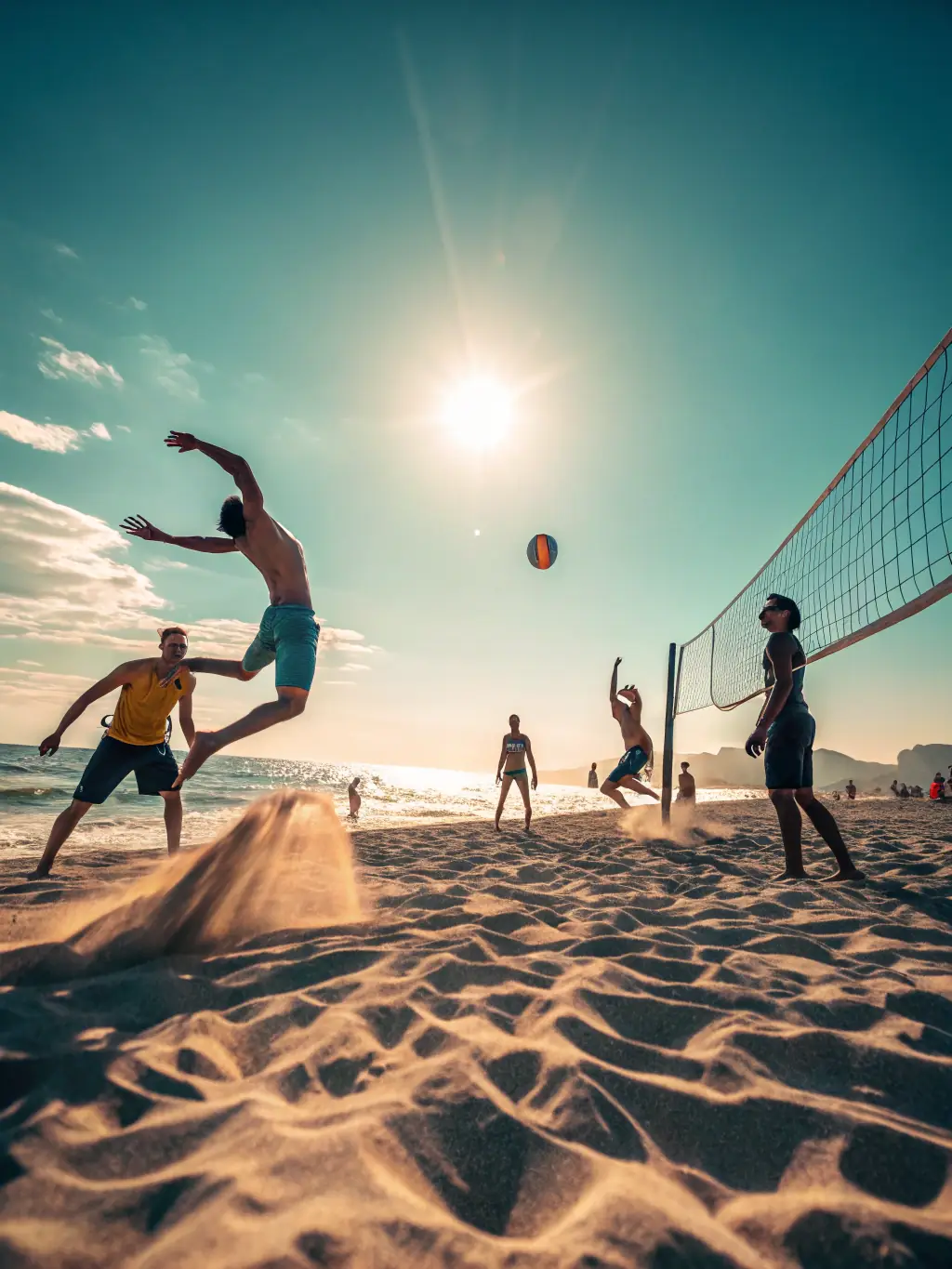 A group of adults engaged in a lively volleyball match on a sandy beach court, with clear blue skies and the ocean in the background.